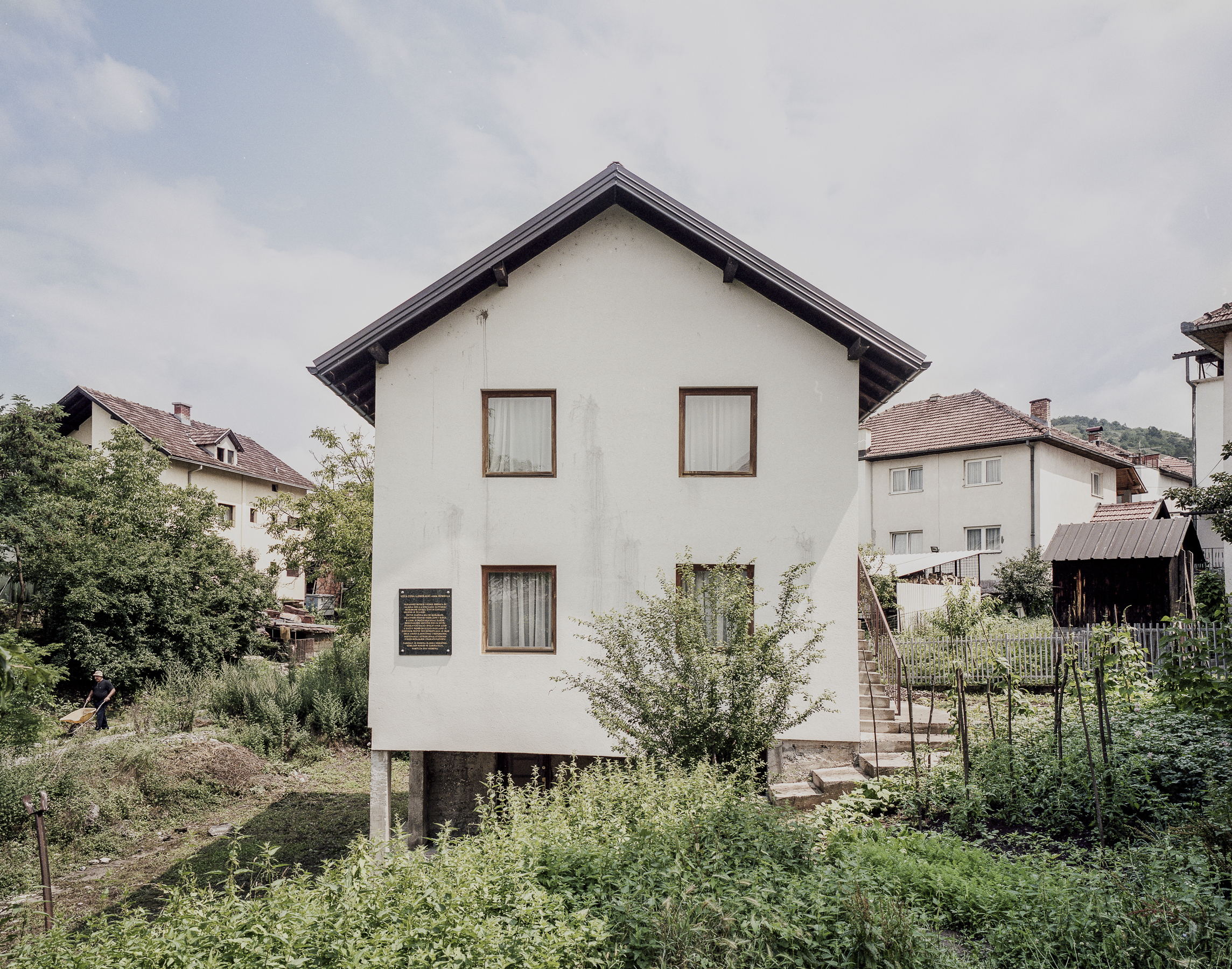 Later in the evening, the group of victims was transferred to the nearby house, where they were locked into a ground-floor room. The evidence shows that the carpet of the room had been prepared with an accelerant. After a while, a lighted, explosive device was placed in the room which ignited an intense fire when it exploded. As the victims tried to escape the flames through the two windows of the room, they were shot at by the armed men outside the house. Other explosive devices were also thrown into the room. 59 people were burned alive.